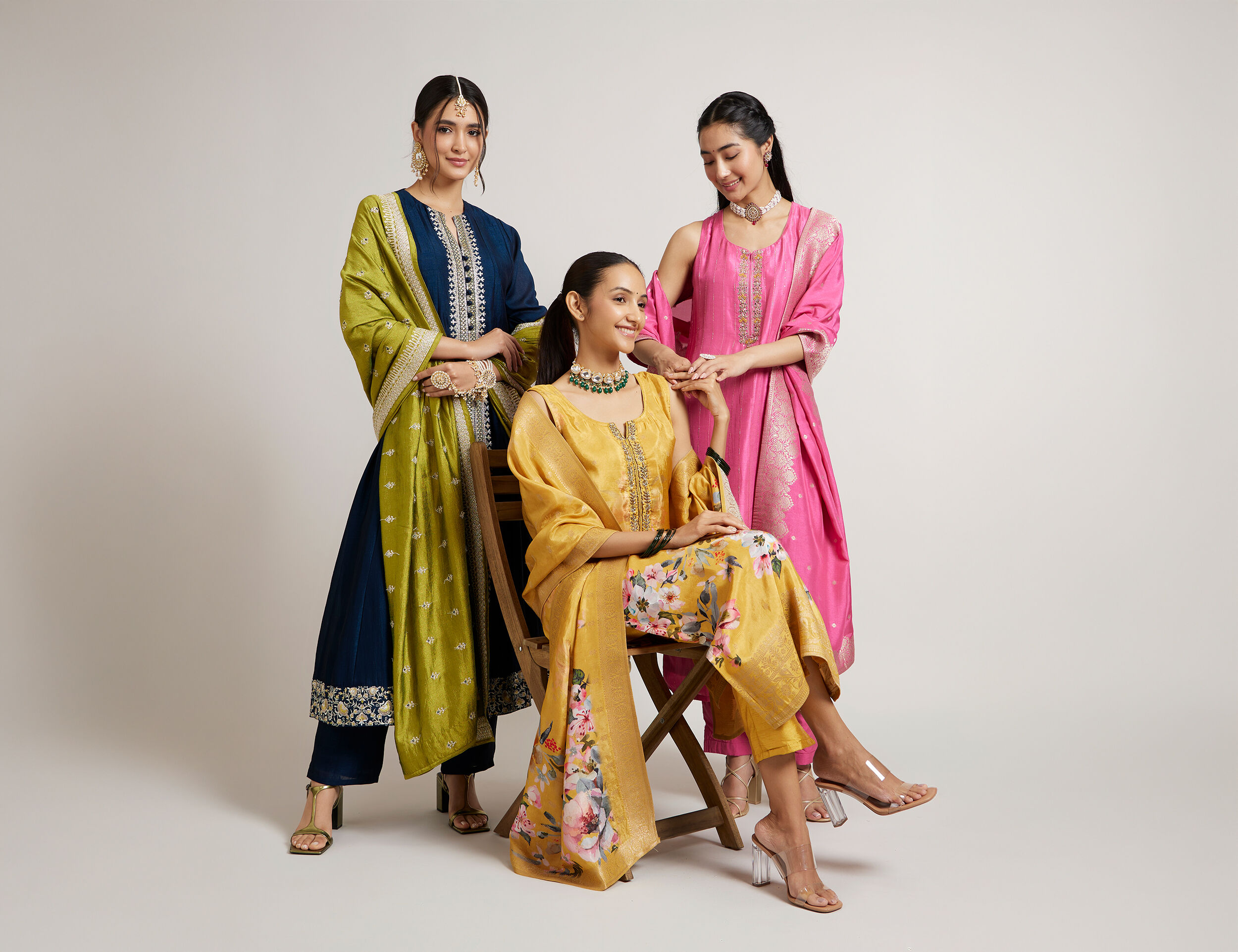 womens wearing elegant blue, yellow and pink kurti 
