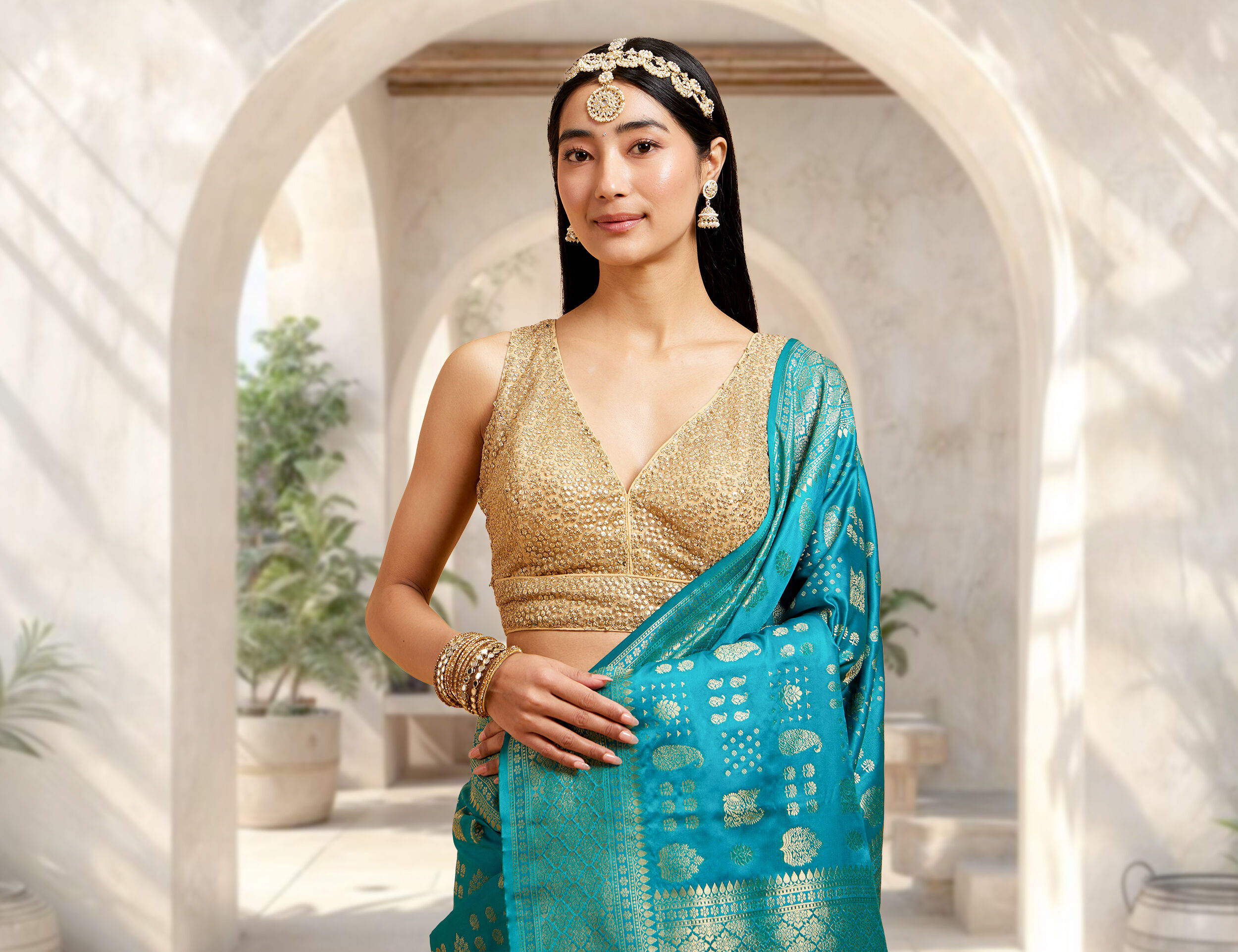 A women in golden designer blouse 