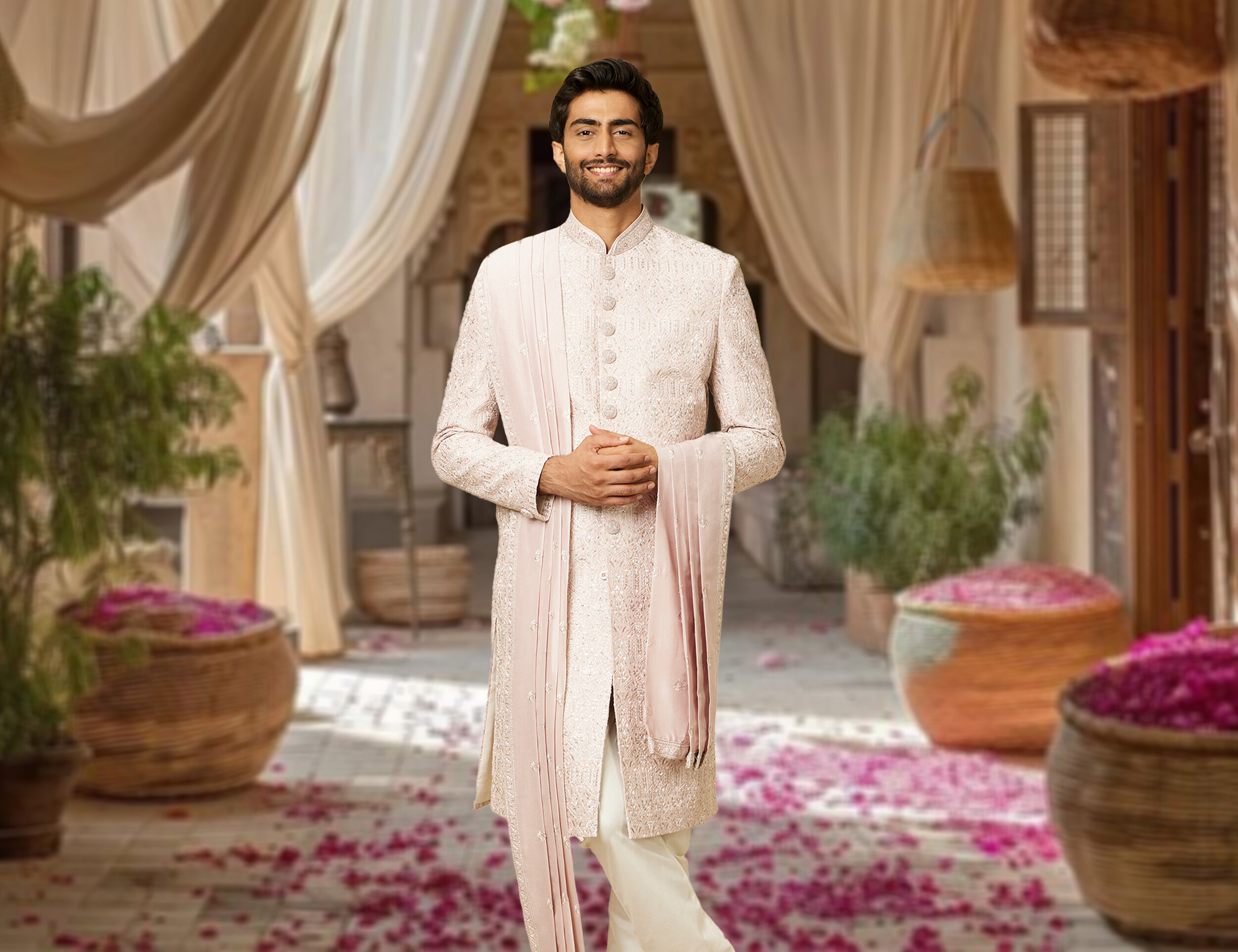 North Indian groom wearing pink sherwani for the wedding