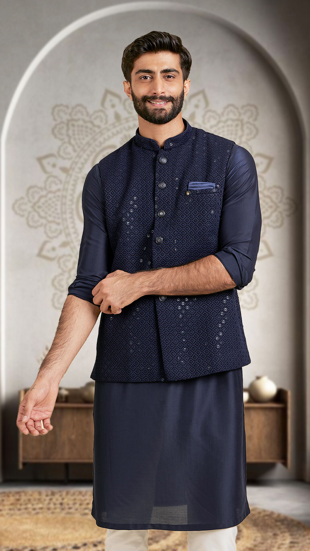 A man wearing beautifull blue kurta jacket set in wedding