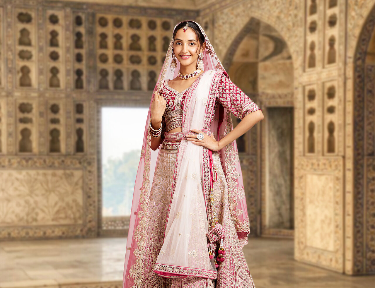A bridee wearing elegant pink lehenga for wedding photoshoot