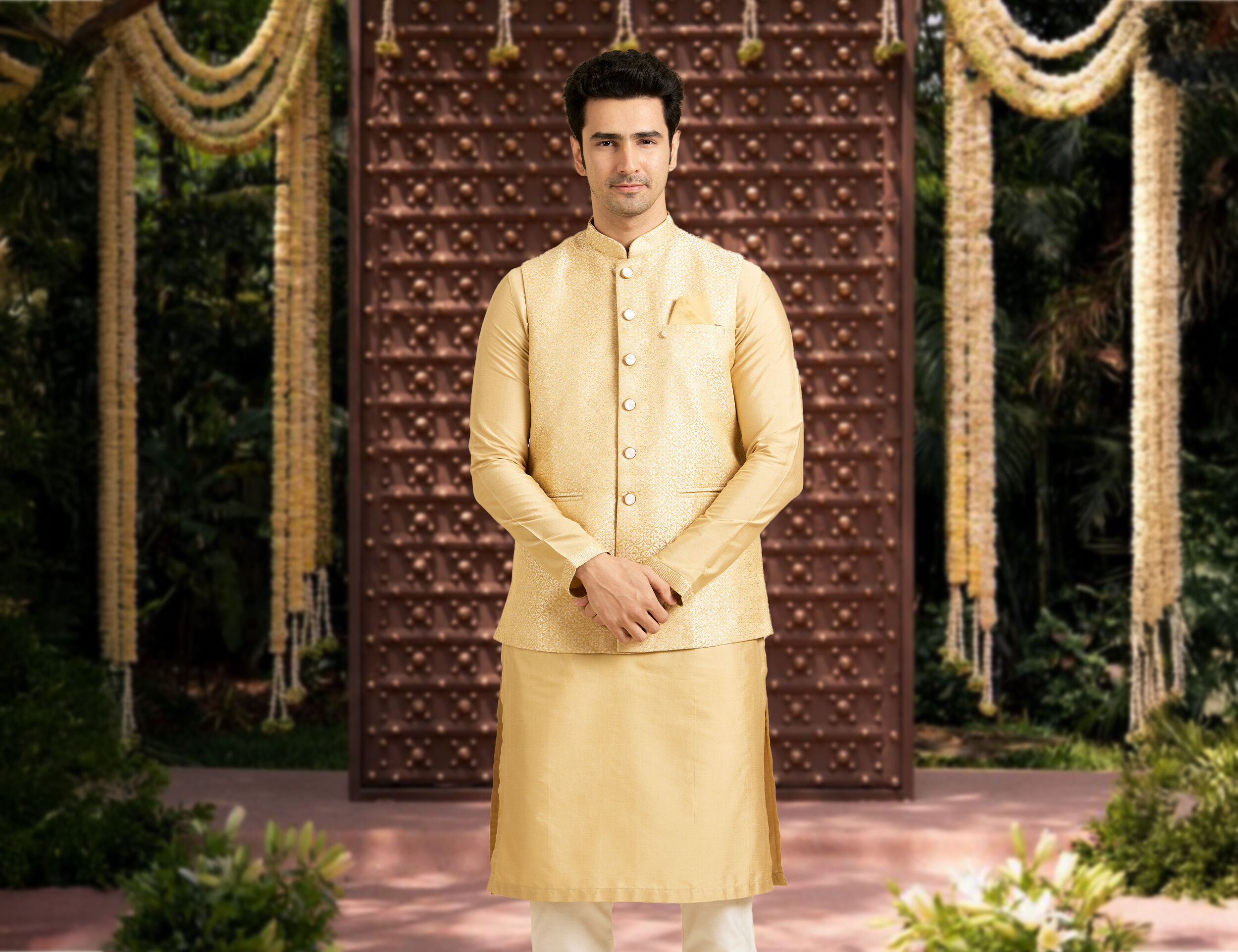 A man in a bright yellow kurta jacket set for wedding