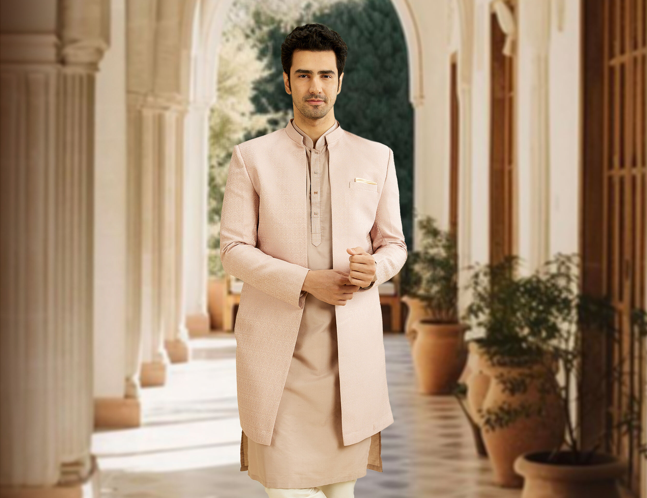 A man in pink kurta jacket 