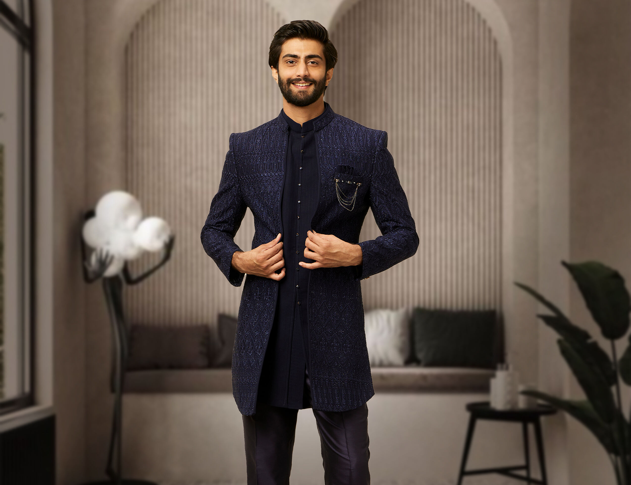 A groom in blue indo western sherwani with blue jacket