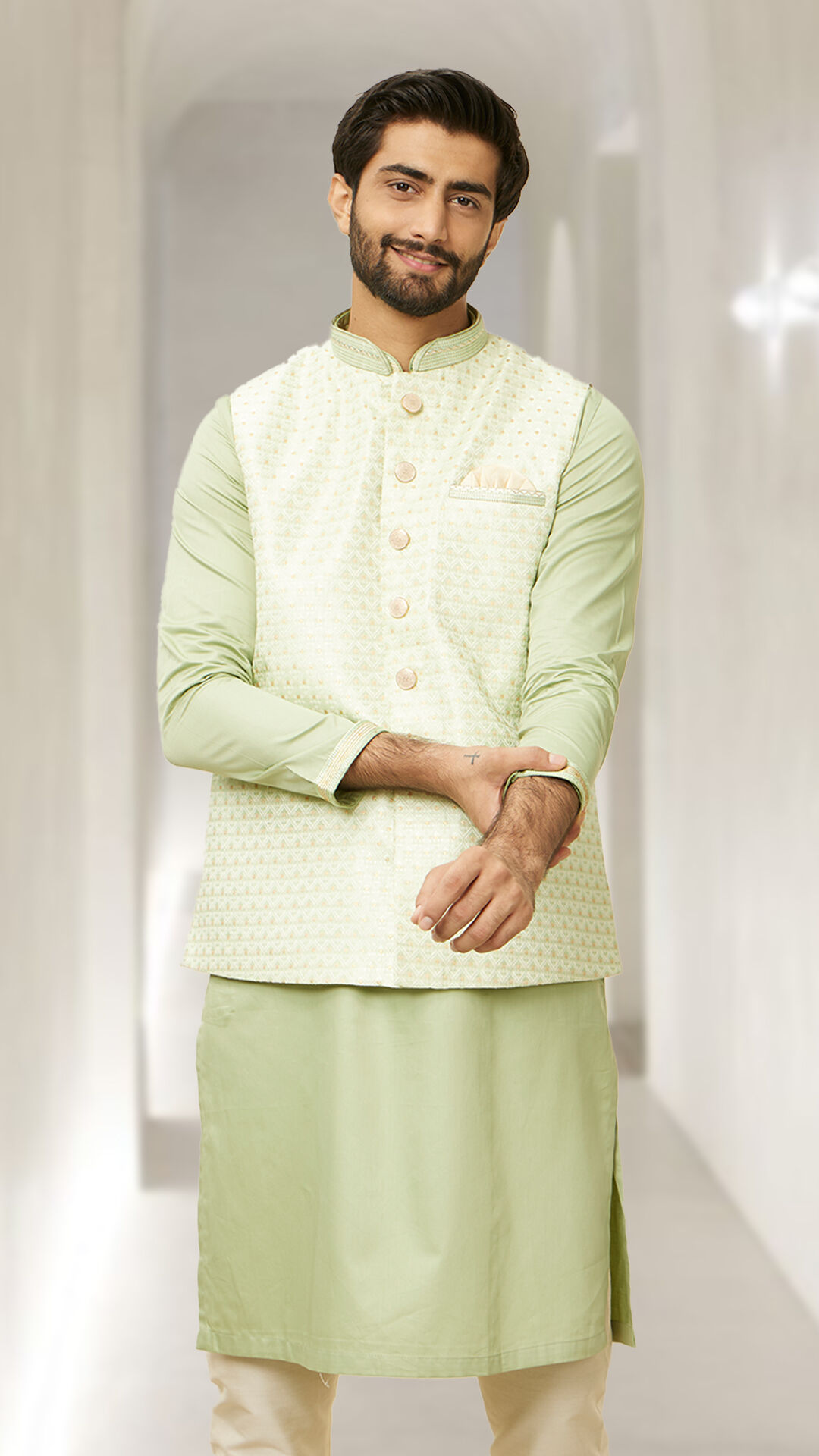 A groom in light green kurta with green jacket set