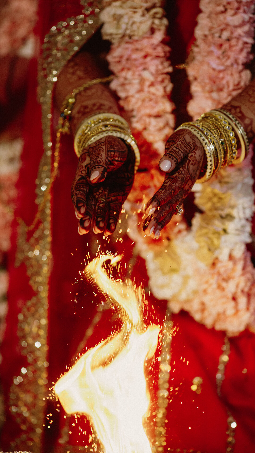 A bride in her wedding ceremony doing wedding rituals