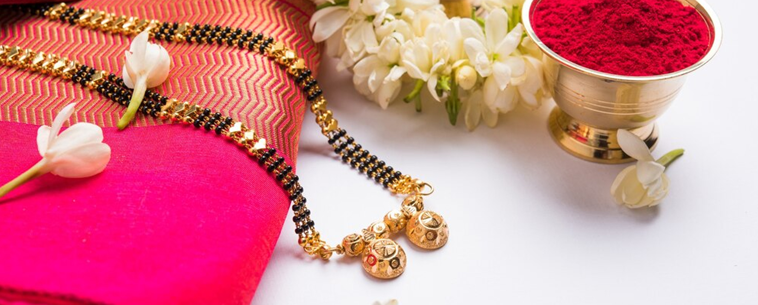 A mangalsutra design with circular pendant with red saree and sindoor A mangalsutra design with circular pendant with red saree and sindoor