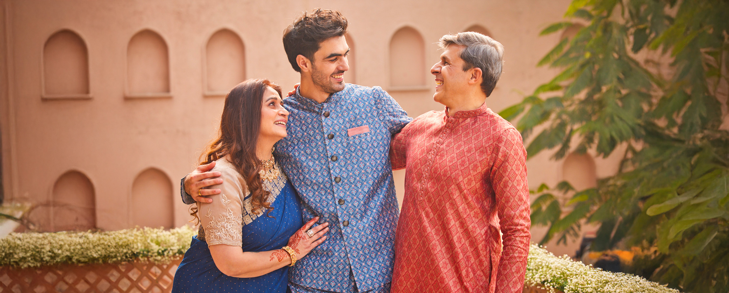 Groom with mother and father both groom and father wearing the stylish sherwani for perfect wedding look. Groom with mother and father both groom and father wearing the stylish sherwani for perfect wedding look.