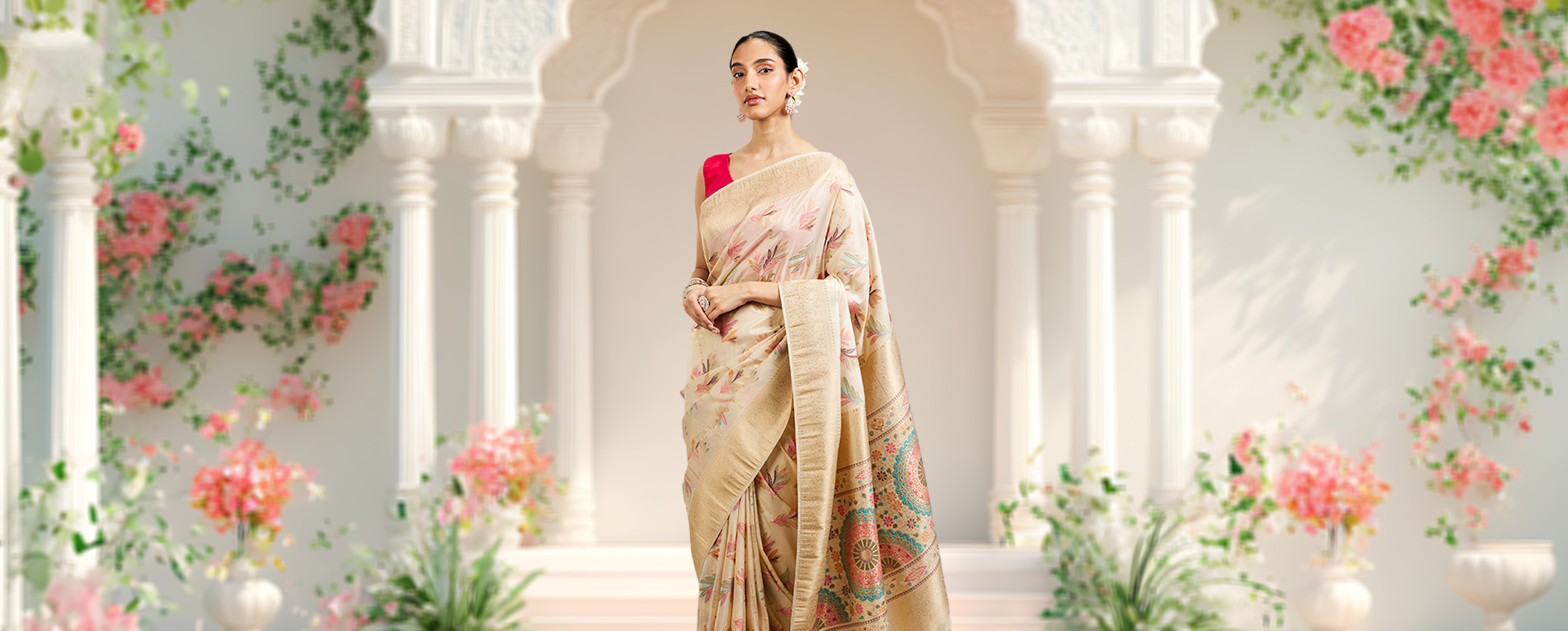 Woman wearing a beautiful cream saree Woman wearing a beautiful cream saree