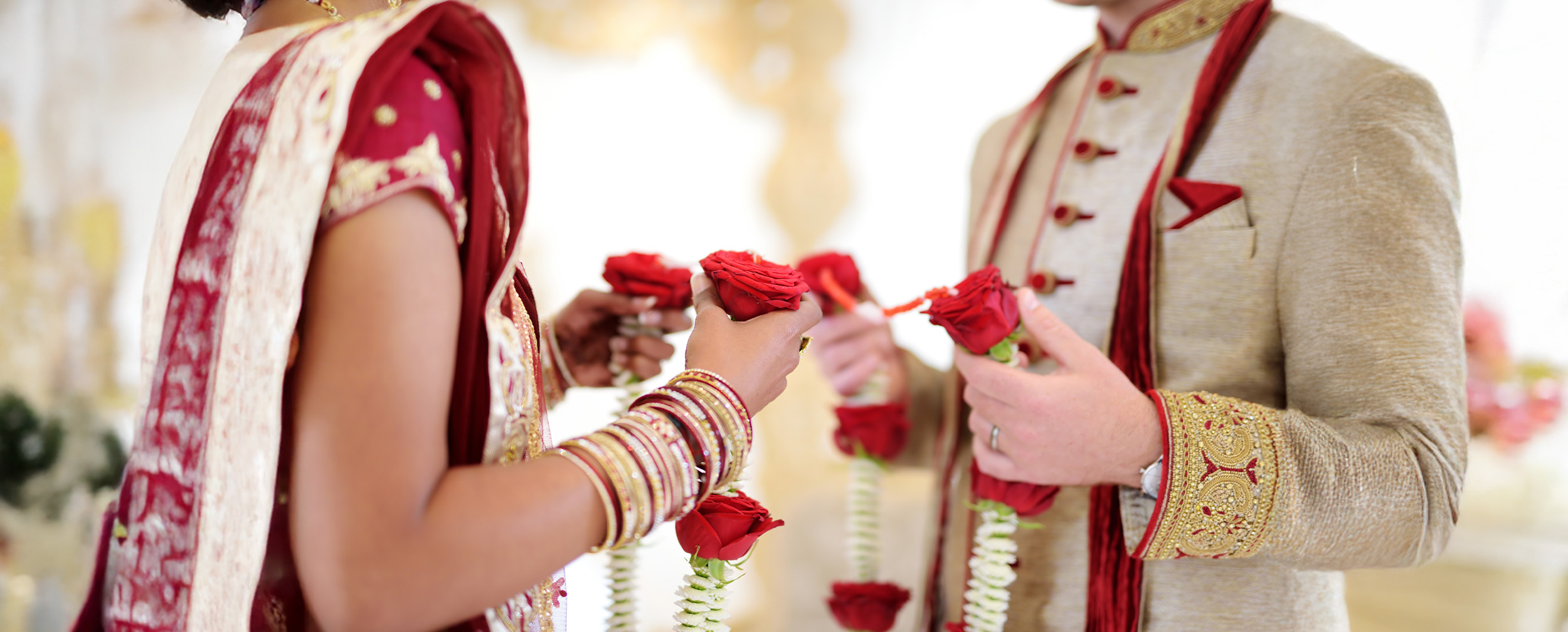 Bride and groom exchanging garlands during their varmala ceremony. Bride and groom exchanging garlands during their varmala ceremony.