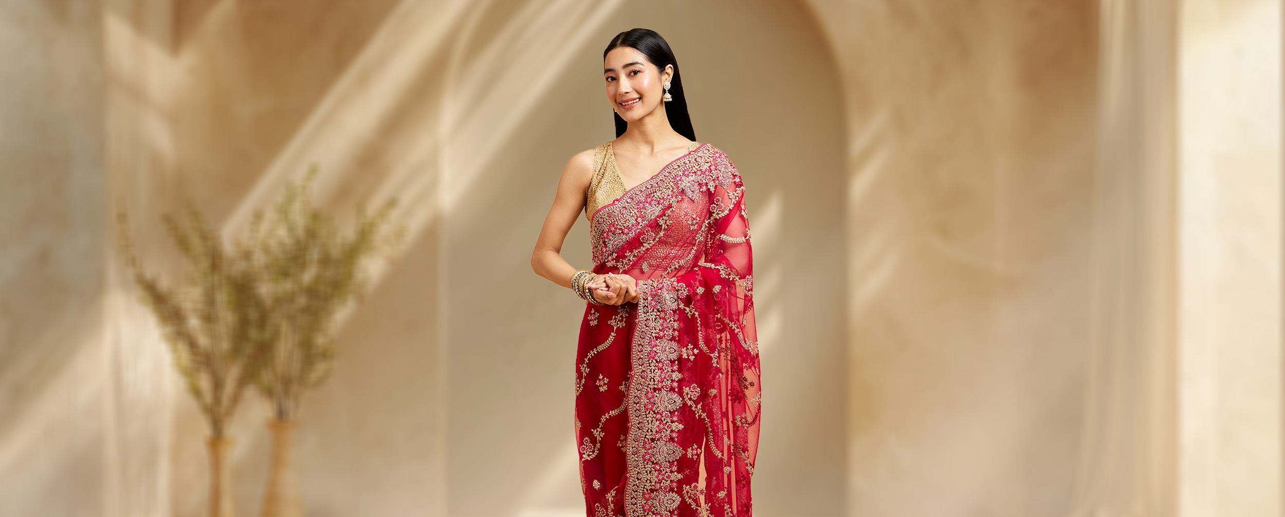Women wearing beautifull red net saree Women wearing beautifull red net saree