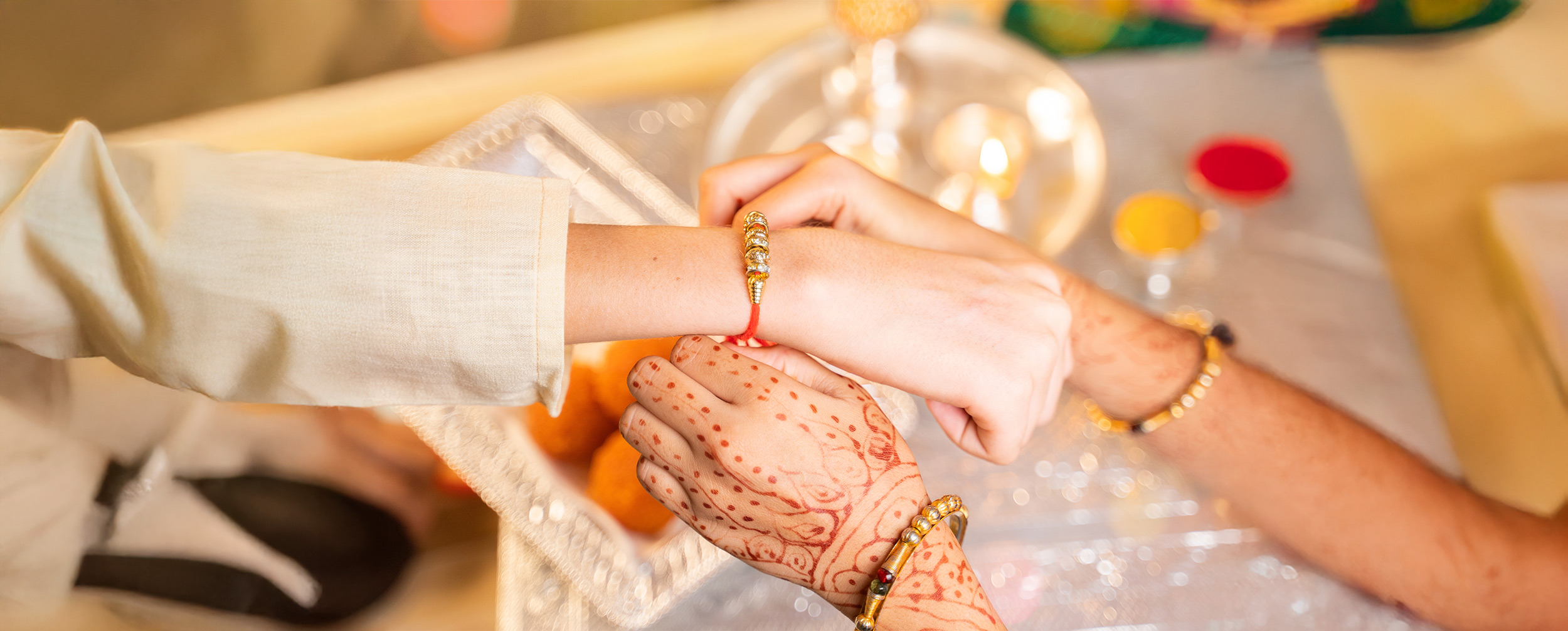 Sister tying a rakhi on her brother’s wrist celebrating the sibling bond for Raksha Bandhan festival Sister tying a rakhi on her brother’s wrist celebrating the sibling bond for Raksha Bandhan festival