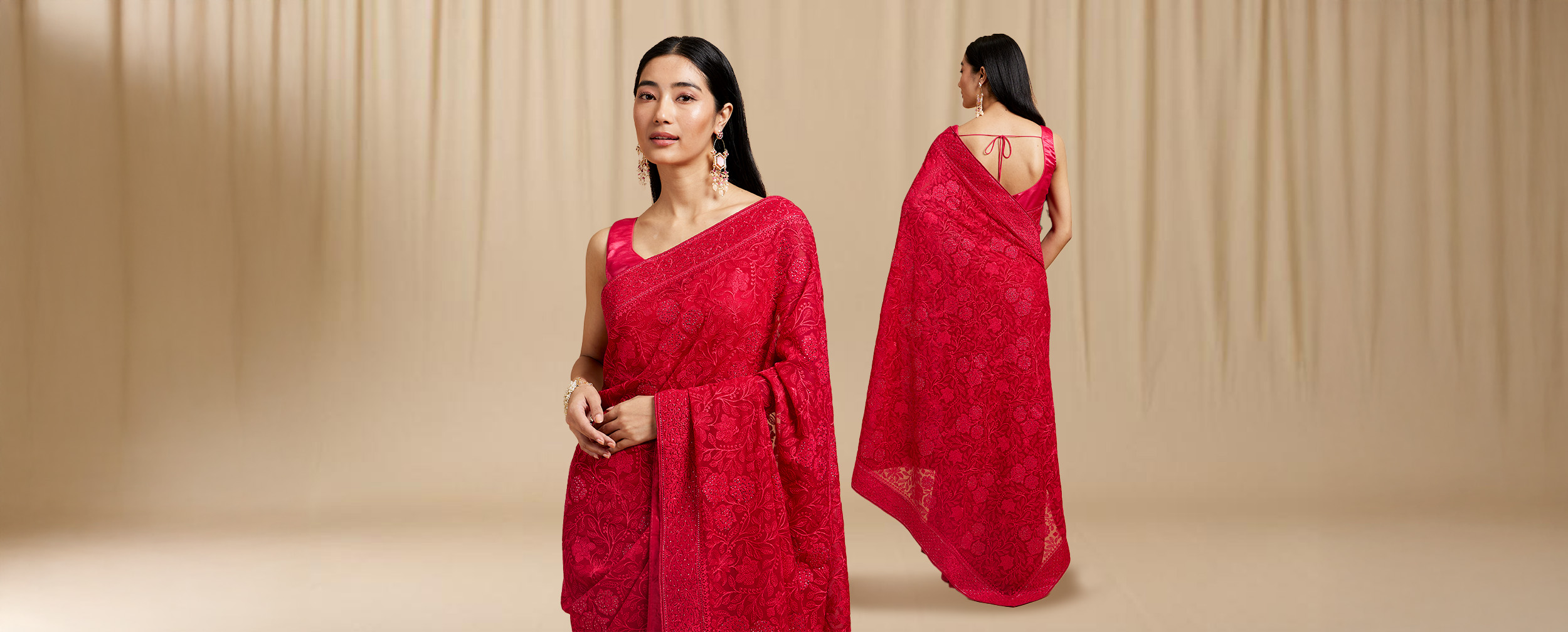 A women in beautifull red saree with beautifull patterns on the border on the saree A women in beautifull red saree with beautifull patterns on the border on the saree