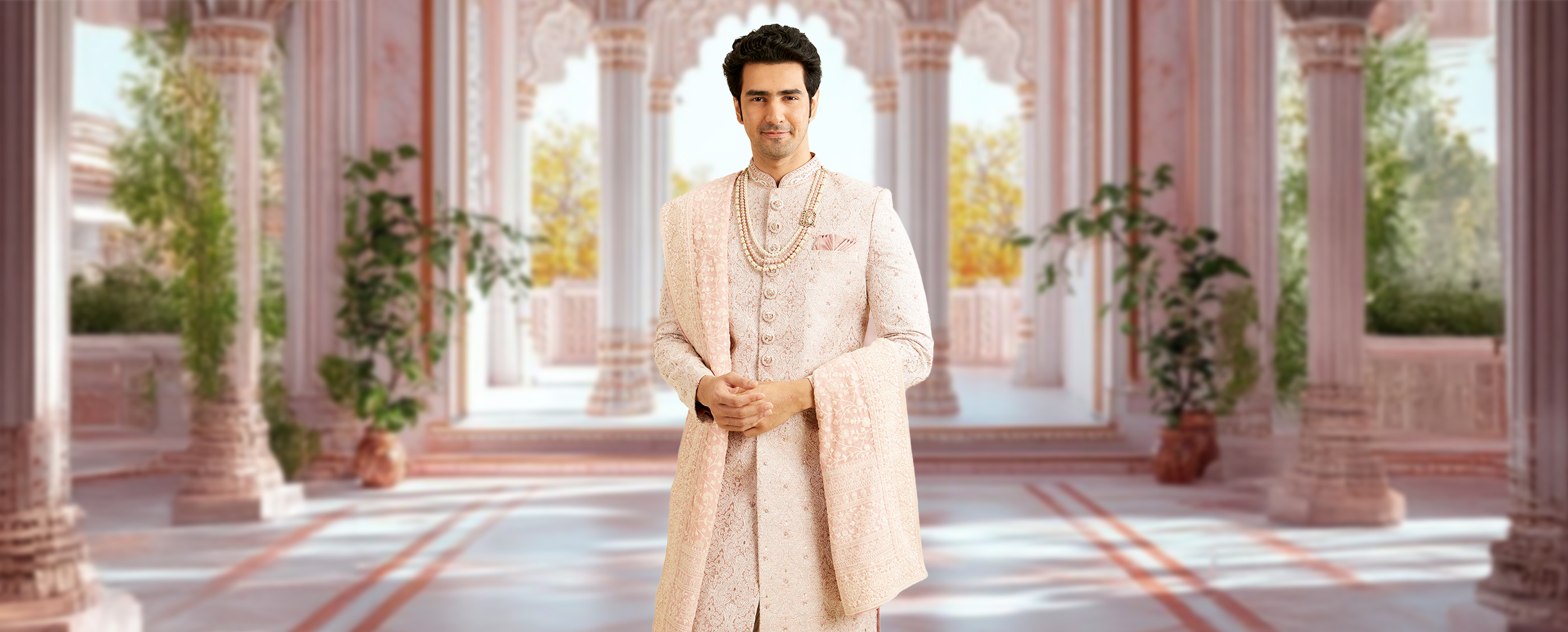 A pink pastel colour sherwani for groom