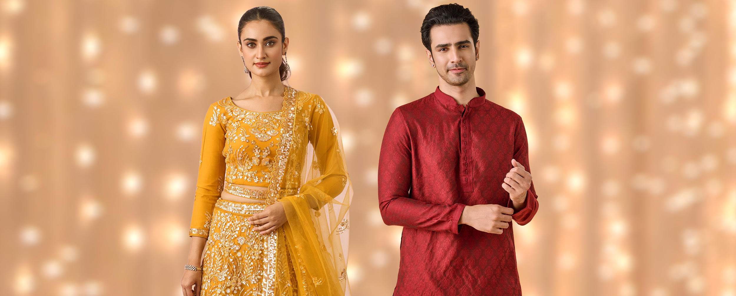 Man in red kurta and woman in golden embellished lehenga showcasing stylish Diwali festive outfits