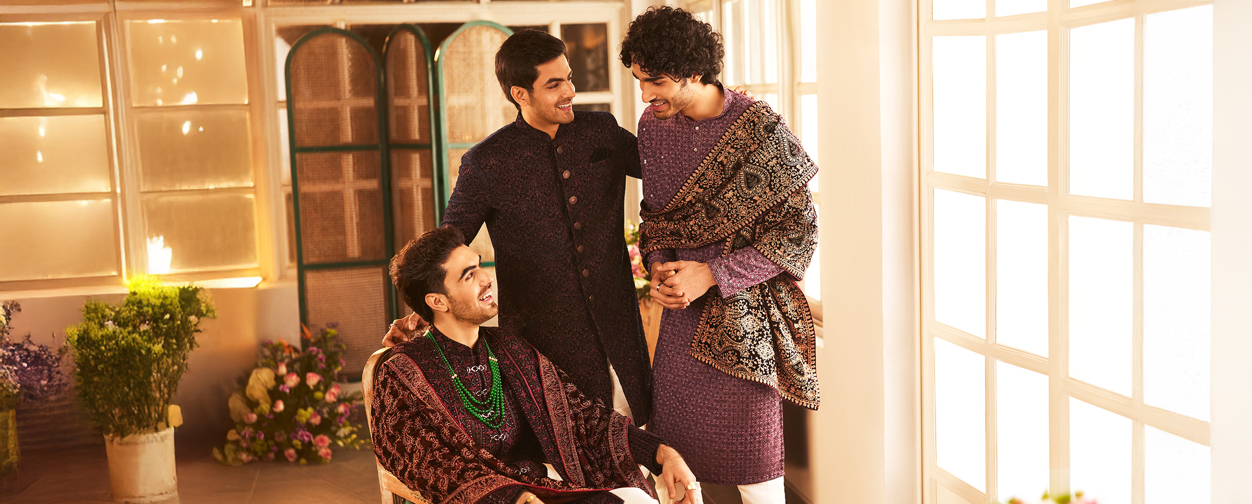 Groom and groomsmen wearing indo western sherwanis for wedding reception Groom and groomsmen wearing indo western sherwanis for wedding reception
