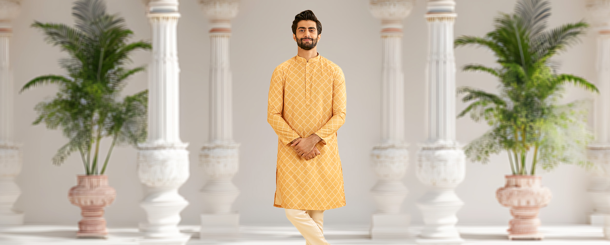 Man wearing a mustard yellow kurta Man wearing a mustard yellow kurta