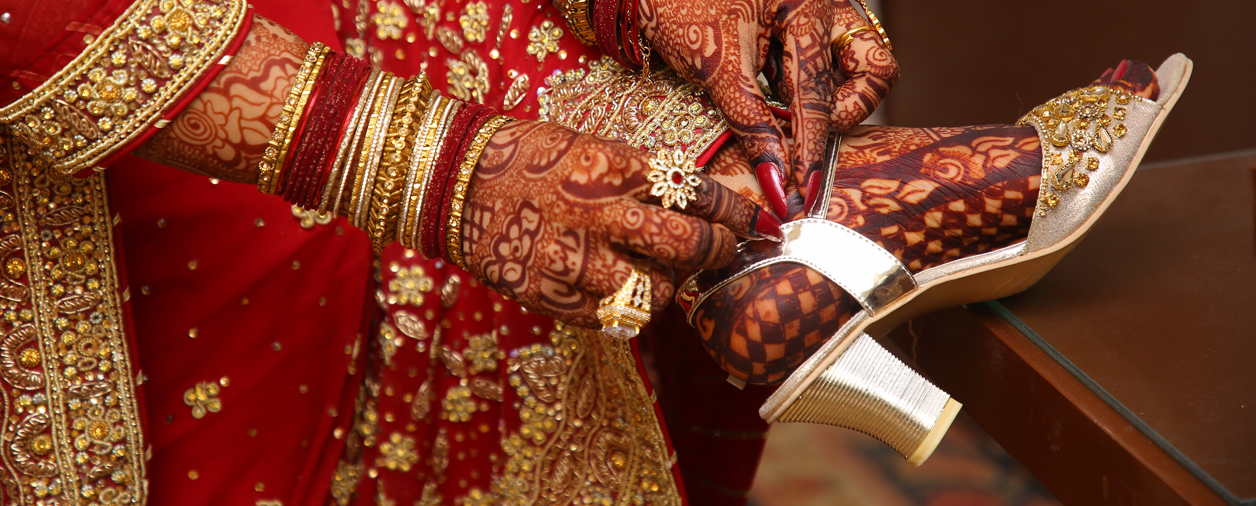 Bride wearing beautiful heels footwear and red lehenga for wedding Bride wearing beautiful heels footwear and red lehenga for wedding