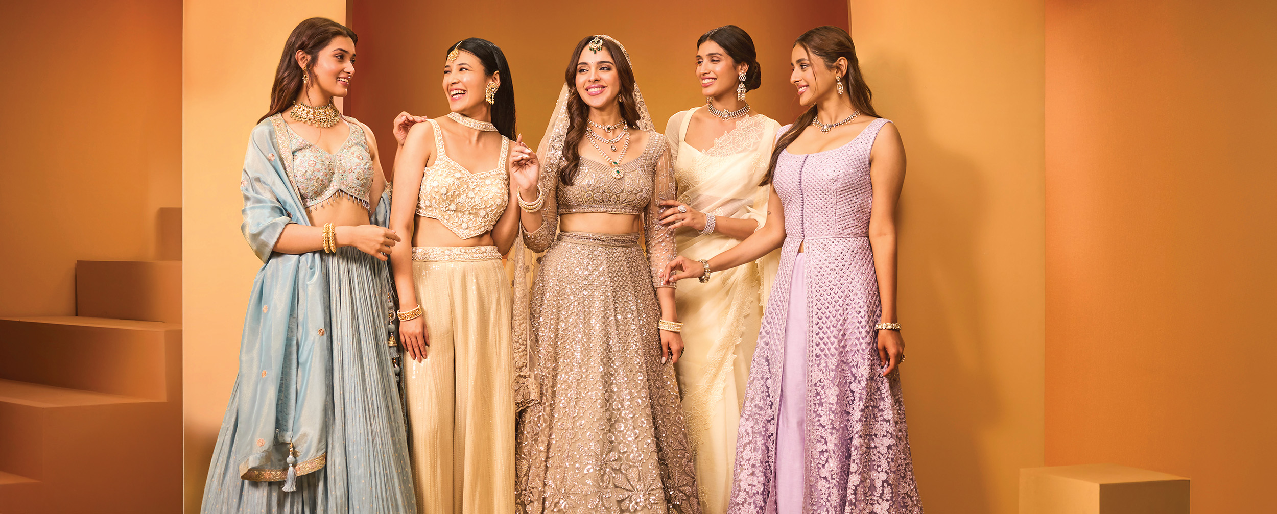 Womans wearing elegant and colourfull pastal lehengas for winter lehenga