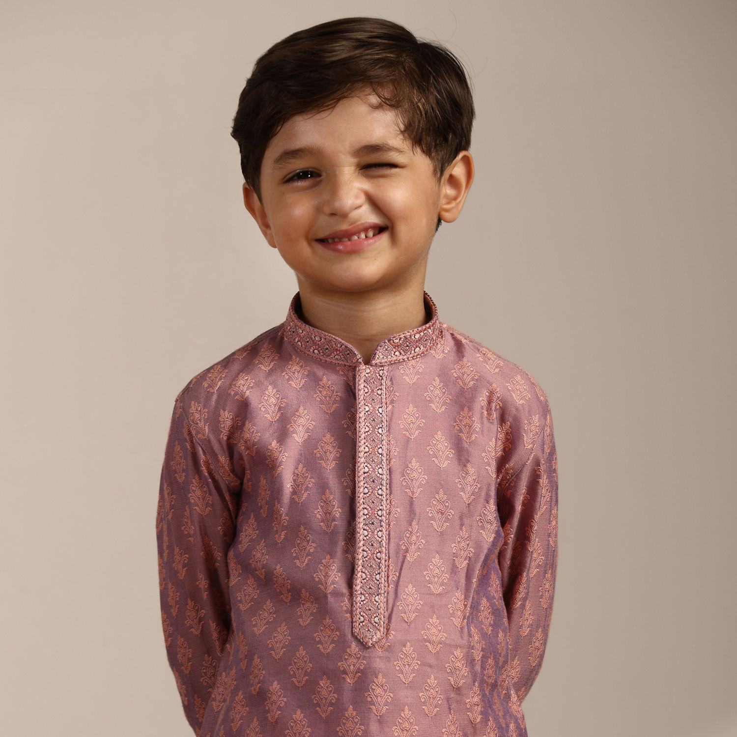 Close up portrait of Indian cute little cheerful brunette Tamil baby boy  wearing casual dress and furry muffler in a black background Stock Photo -  Alamy