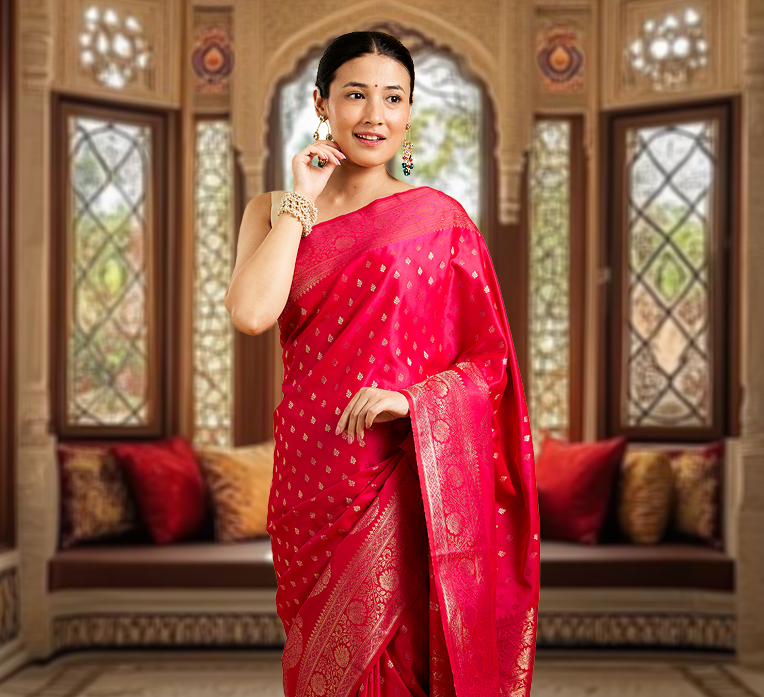 Mother in a red saree styled for a Mother&rsquo;s Day ethnic wear celebration in an elegant festive setting.