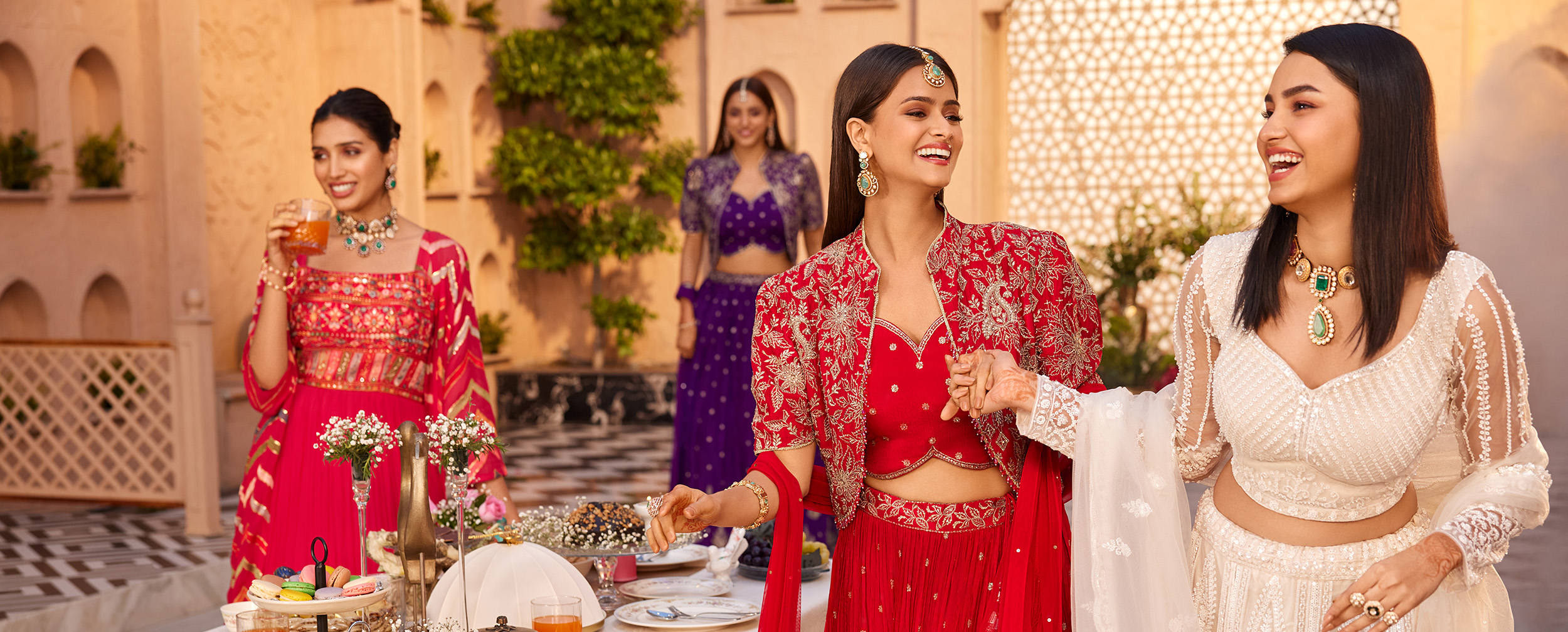 Womens wearing colourfull lehengas with designer choli blouse and matching dupattas. Womens wearing colourfull lehengas with designer choli blouse and matching dupattas.