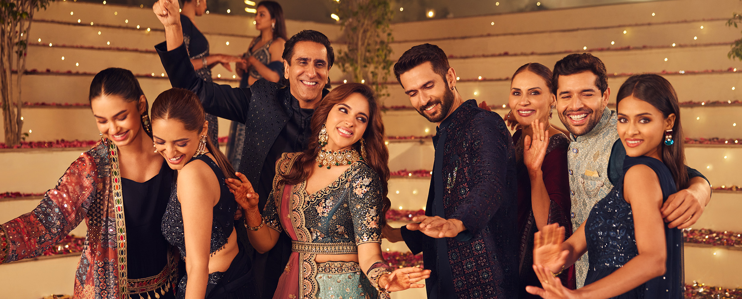 Bride and groom dancing with friends during wedding celebration Bride and groom dancing with friends during wedding celebration