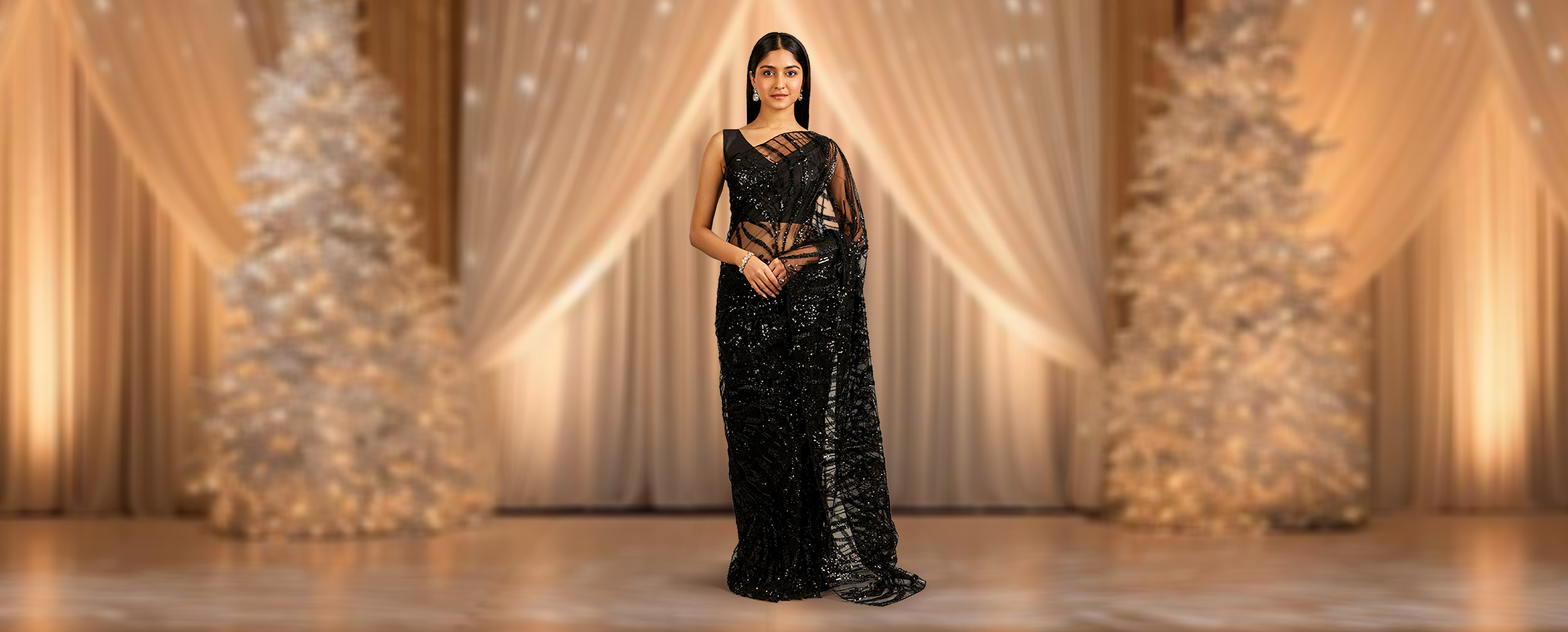 A woman wearing black saree for evening glam A woman wearing black saree for evening glam