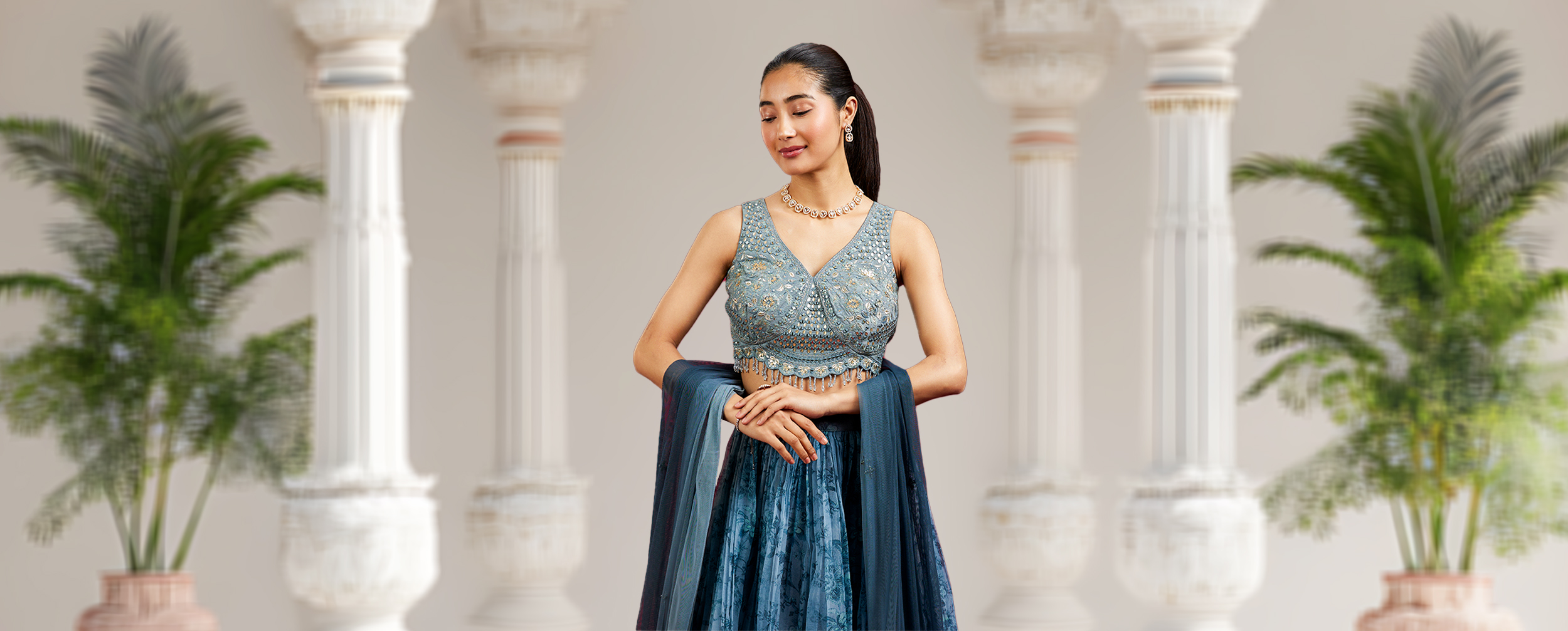 Women wearing beautifull blue lehenga with modern style backlace blouse Women wearing beautifull blue lehenga with modern style backlace blouse