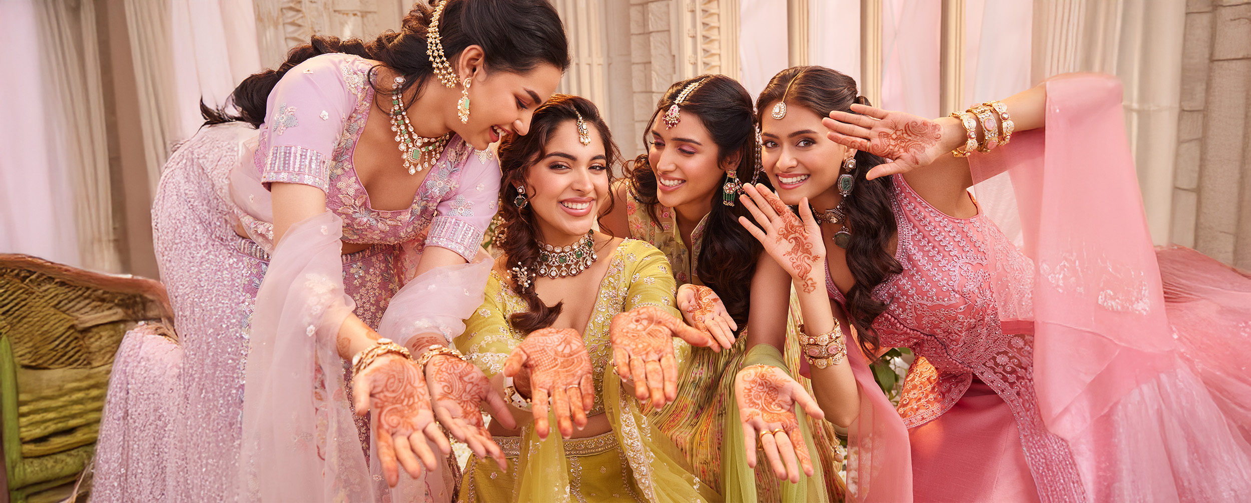 Bride and her friends joyfully showcasing their intricate and beautiful Mehendi designs Bride and her friends joyfully showcasing their intricate and beautiful Mehendi designs
