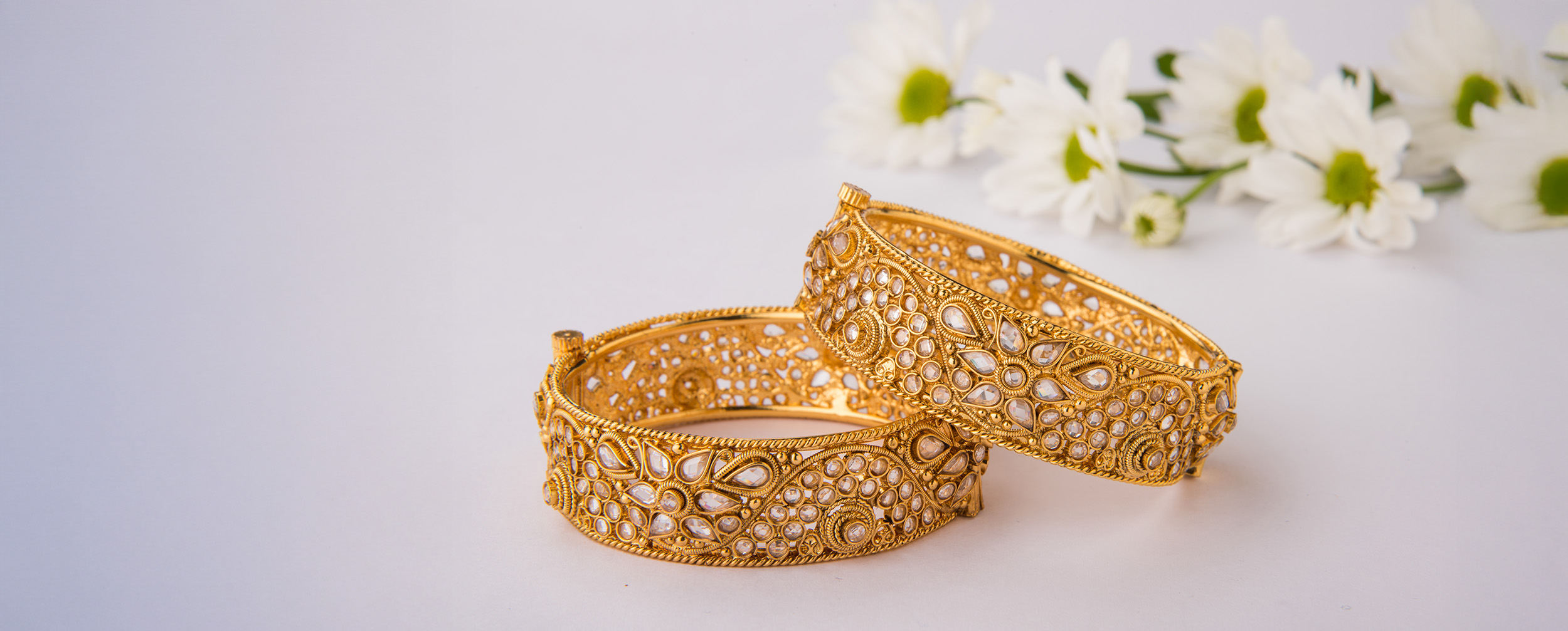 Beautiful designer gold bangles for bride to ace fusion wedding look Beautiful designer gold bangles for bride to ace fusion wedding look