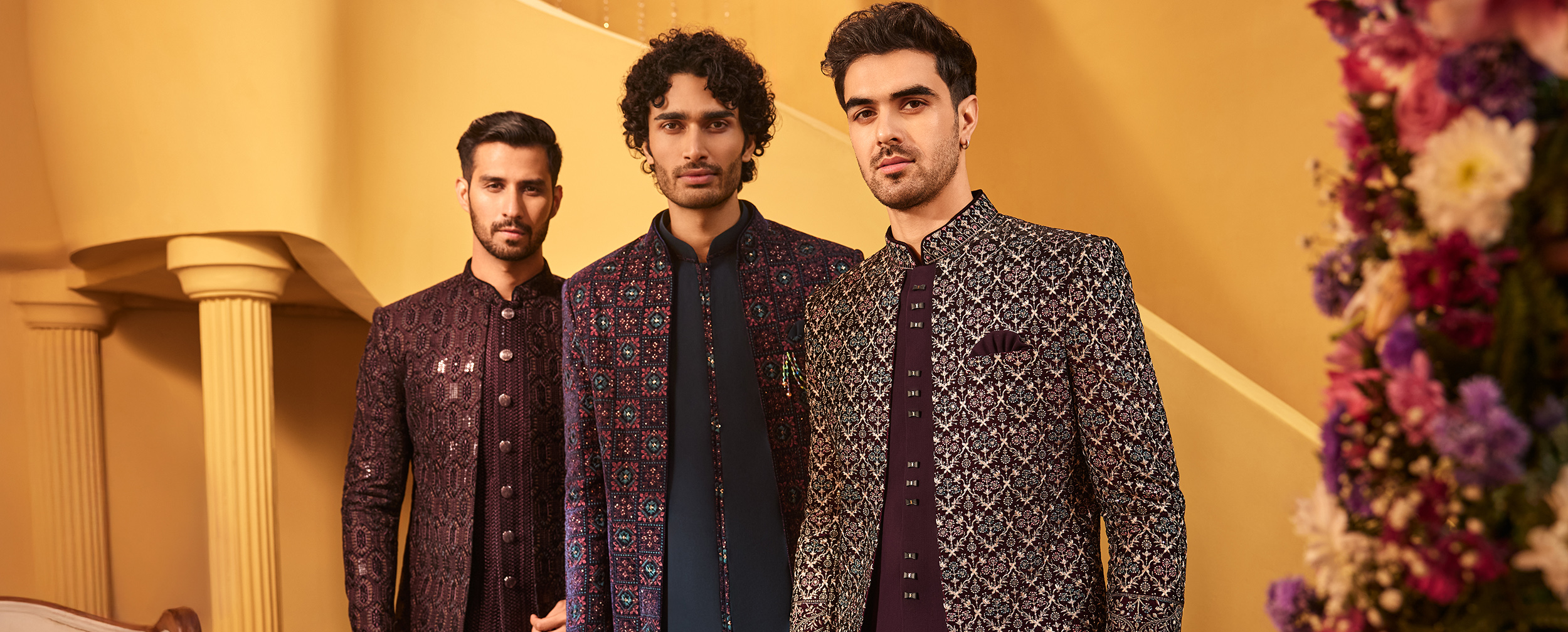 Three men in stylish embroidered sherwanis showcasing elegant Indian groom wedding attire collection. Three men in stylish embroidered sherwanis showcasing elegant Indian groom wedding attire collection.