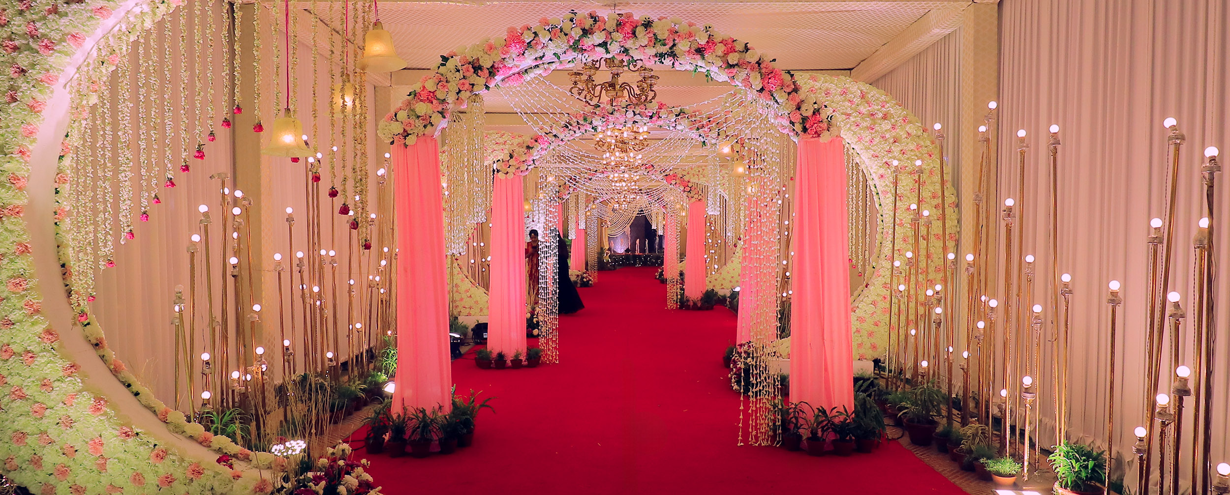 Stunning bridal entry decoration with elegant designs for a grand wedding entrance." Stunning bridal entry decoration with elegant designs for a grand wedding entrance."