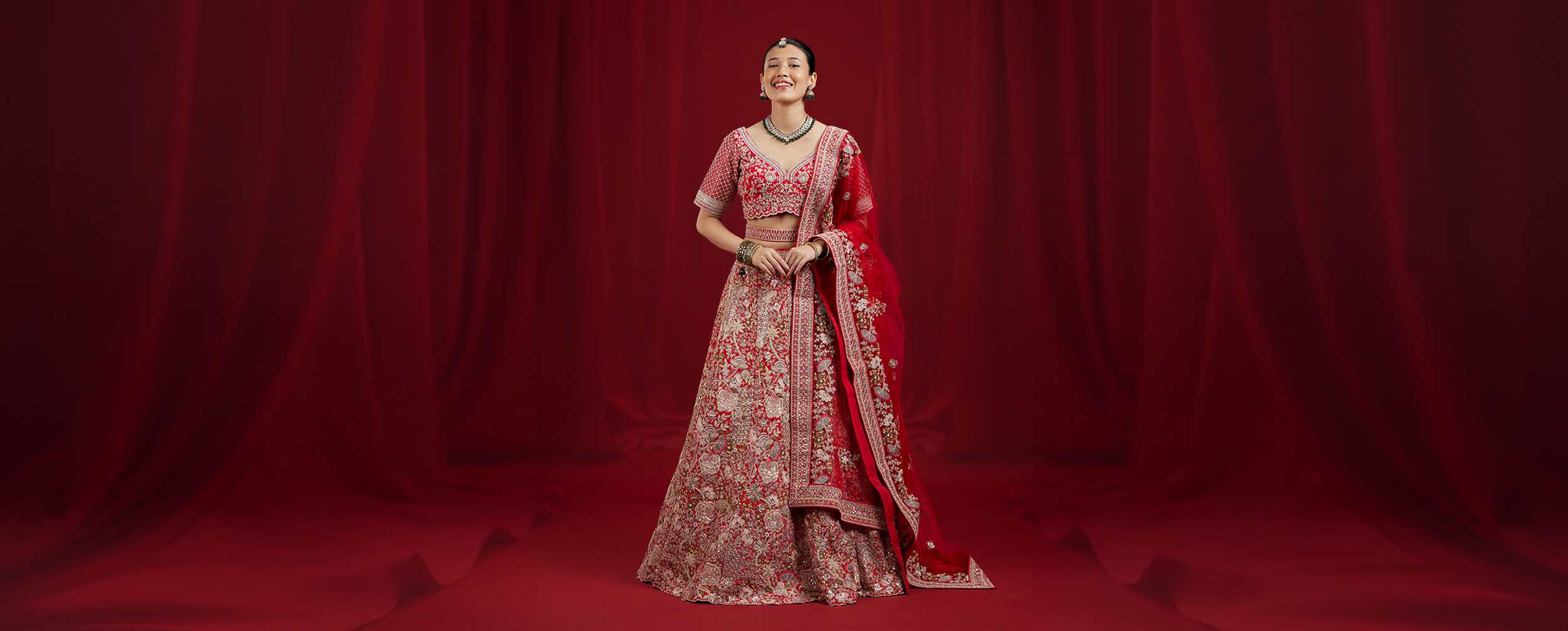 Textured red lehenga styled for a modern Indian bride Textured red lehenga styled for a modern Indian bride