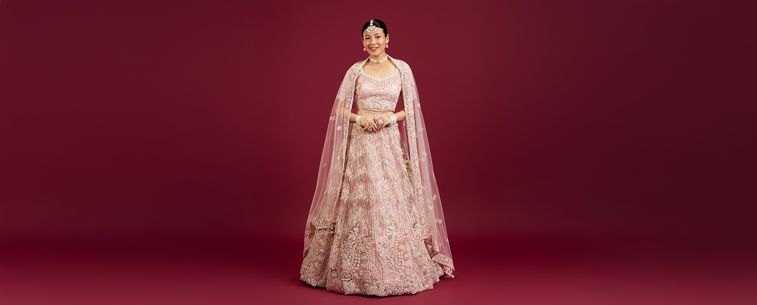 Women wearing beautiful pink pastel lehenga to wear in wedding Women wearing beautiful pink pastel lehenga to wear in wedding