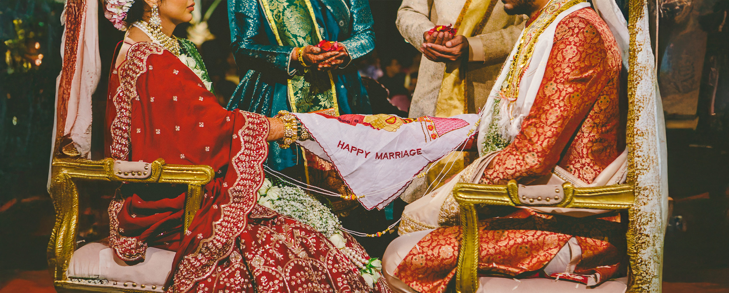 Gujrati bride and groom performing Gujarati wedding ritulas Gujrati bride and groom performing Gujarati wedding ritulas