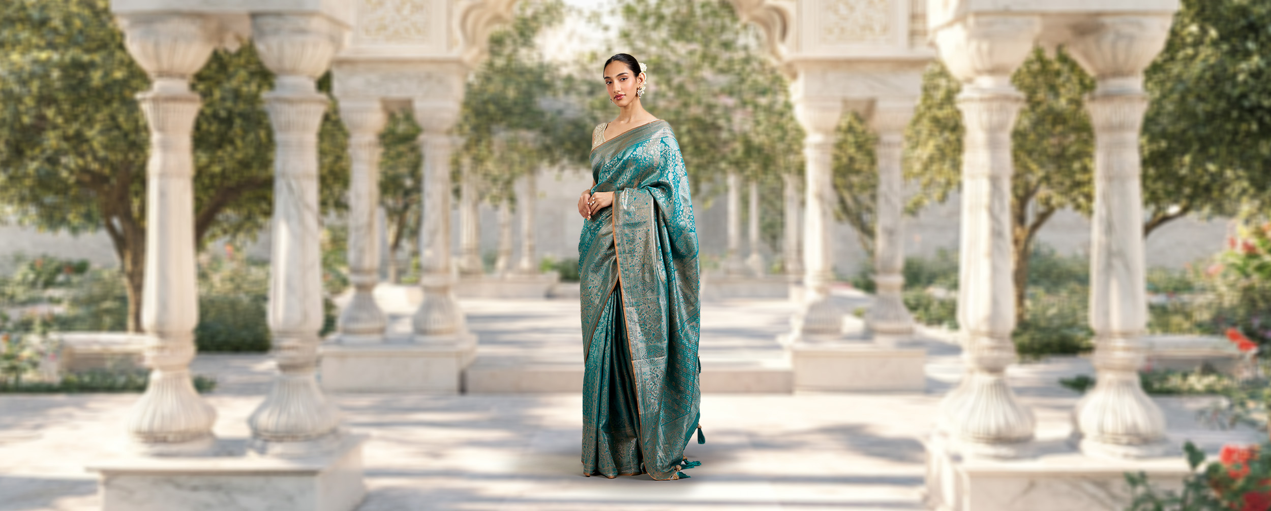 Bride in a pre-wedding photoshoot wearing a uniquely draped blue wedding saree Bride in a pre-wedding photoshoot wearing a uniquely draped blue wedding saree