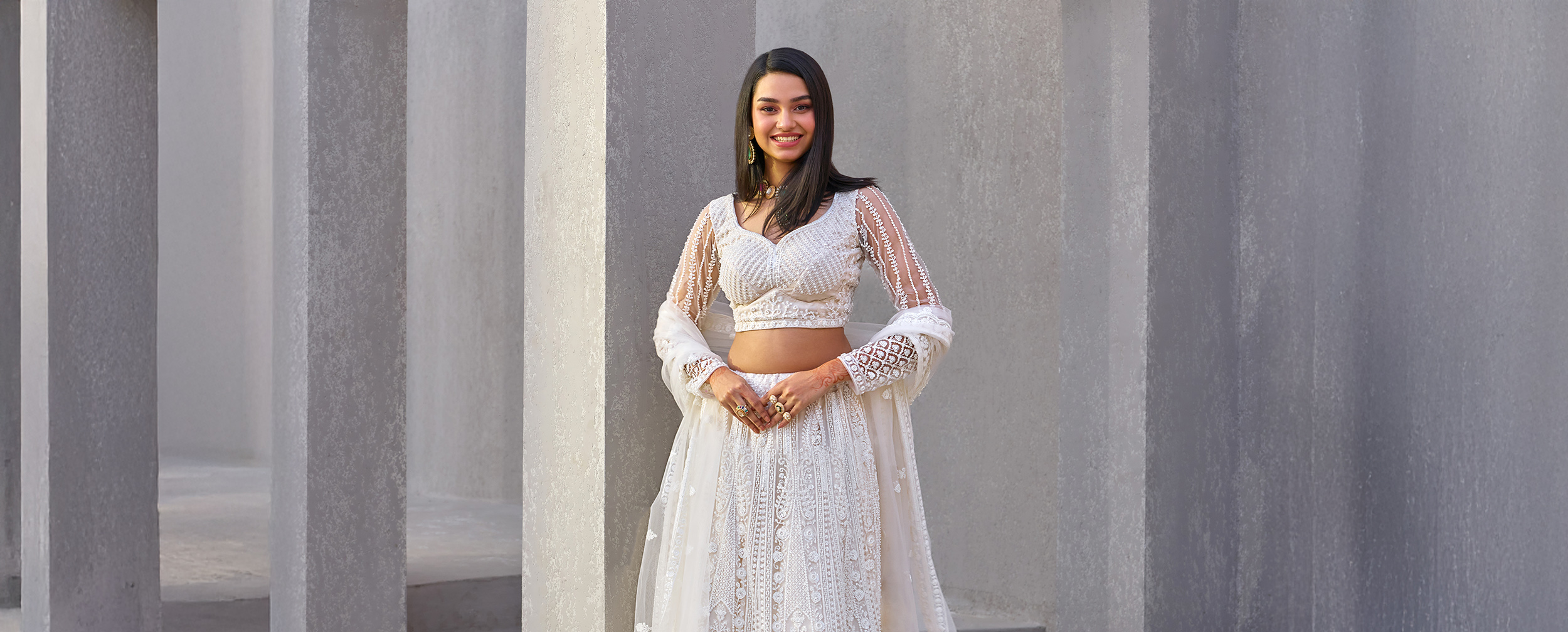 Women wearing stylish white lehenga on mother's day for a special celebration Women wearing stylish white lehenga on mother's day for a special celebration