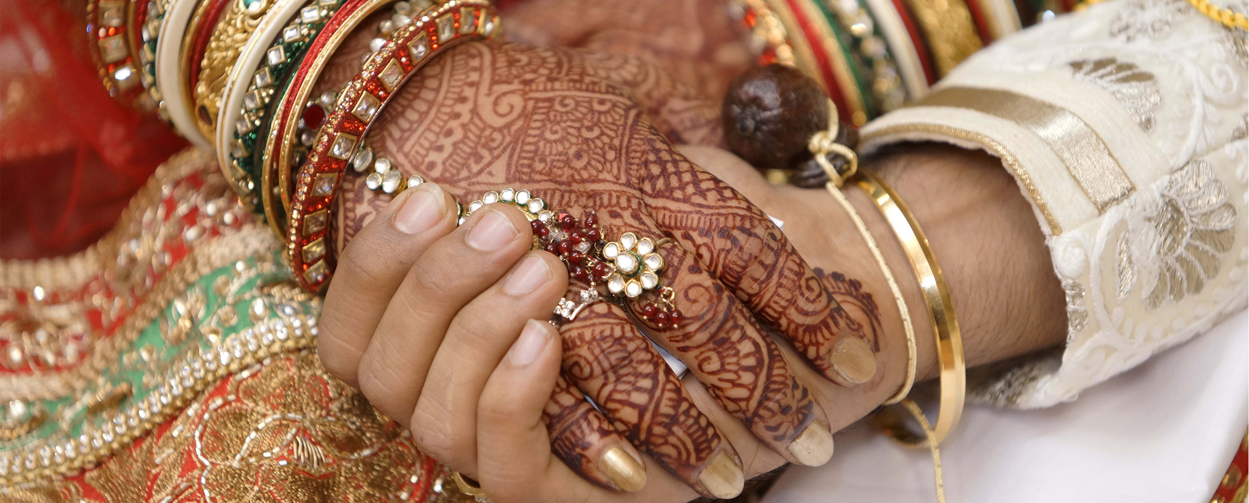 Romantic moment of a bride holding the groom’s hand during their post-wedding celebration Romantic moment of a bride holding the groom’s hand during their post-wedding celebration