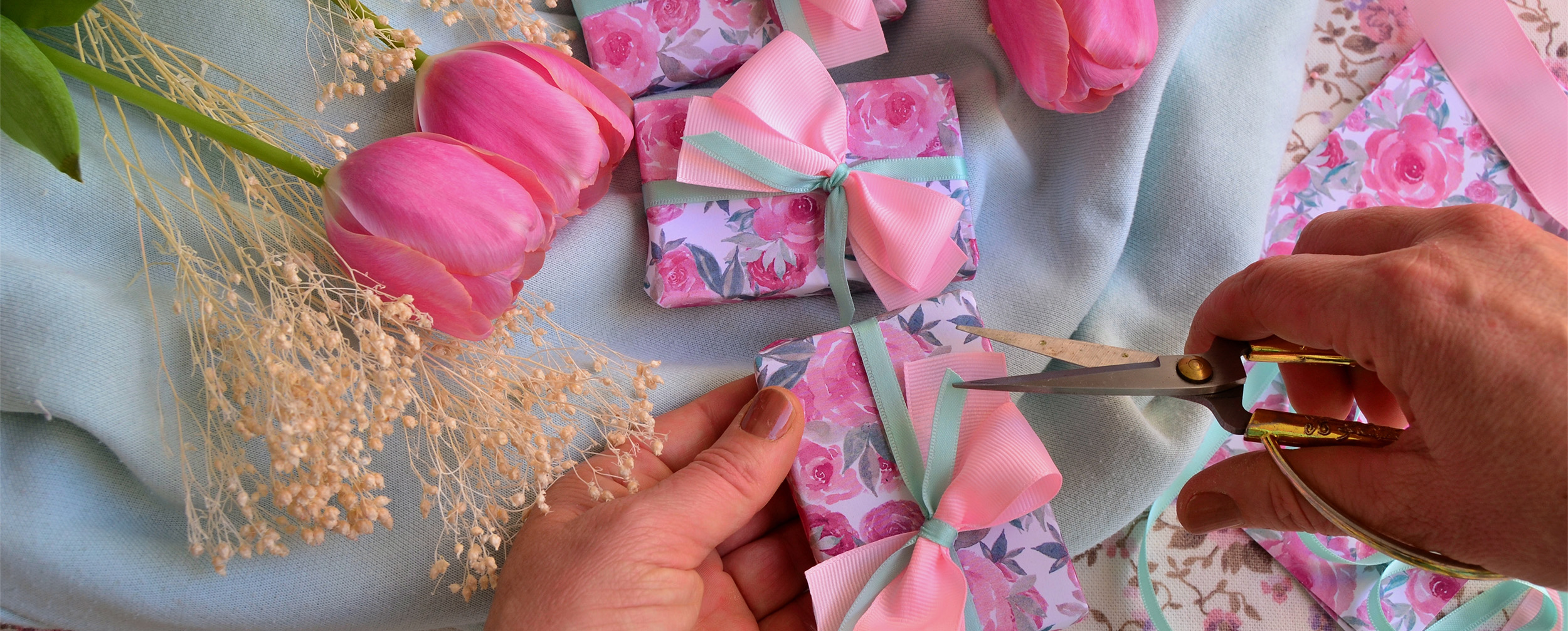 A beautifull small pink gift boxes with pink ribon on it with pink roses near it for bridal shower. A beautifull small pink gift boxes with pink ribon on it with pink roses near it for bridal shower.