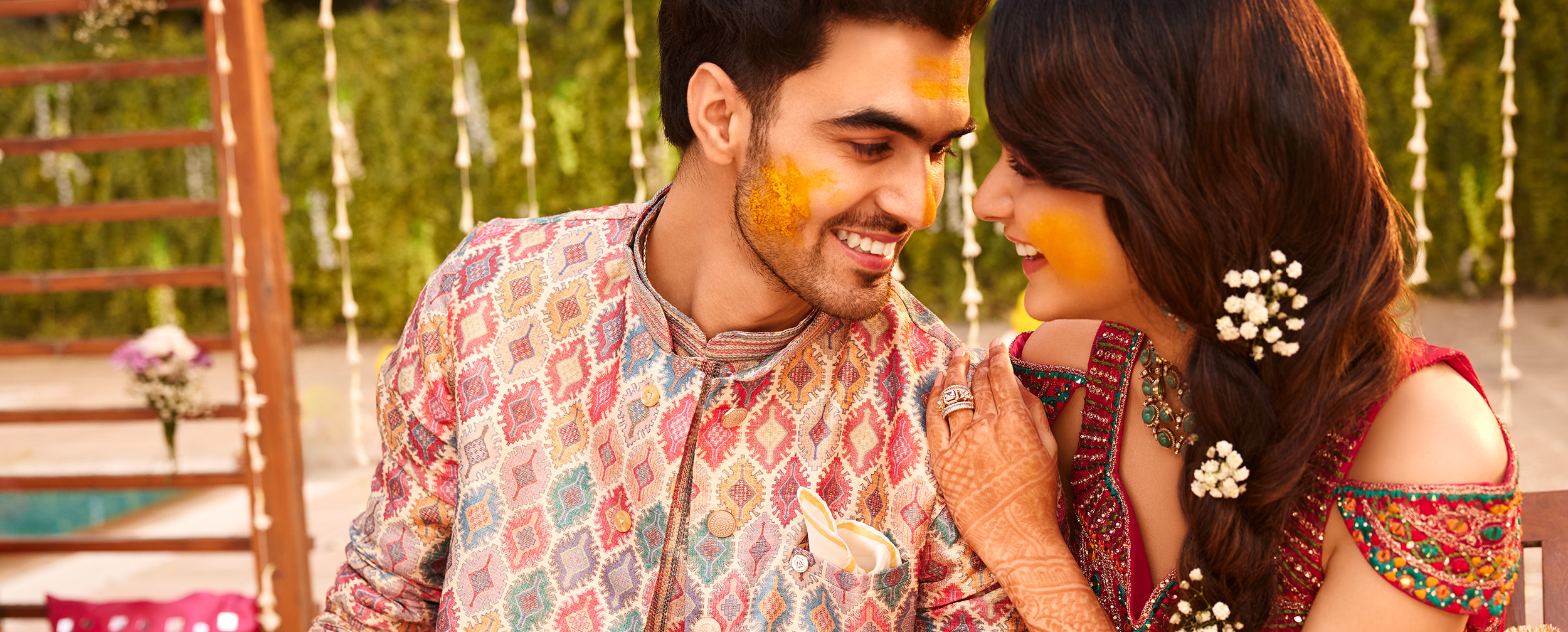 Happy couple in colorful traditional attire with haldi ceremony celebrations and candid pre-wedding photography. Happy couple in colorful traditional attire with haldi ceremony celebrations and candid pre-wedding photography.