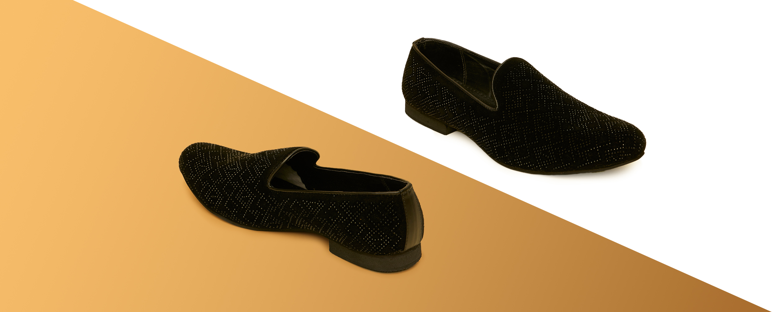 Black velvet studded loafers (shoes) displayed on a diagonal white and brown background.