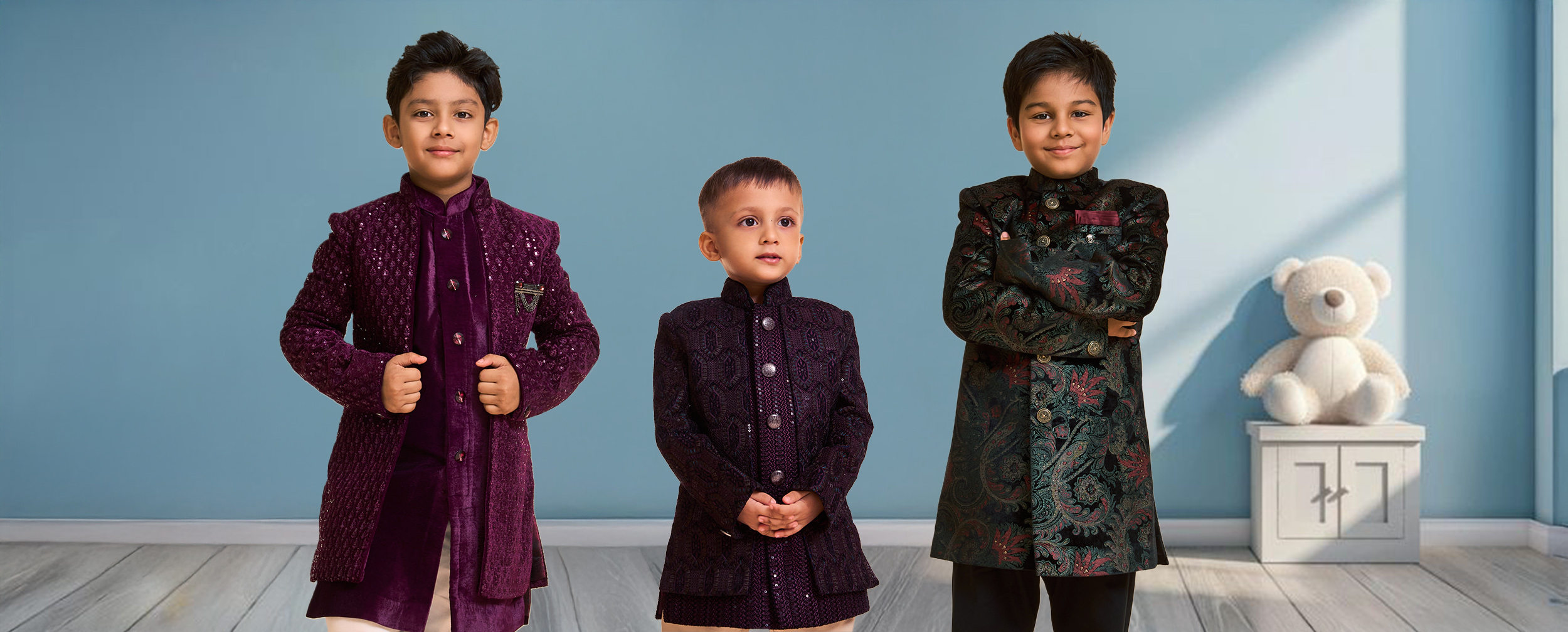 Three young boys in richly embroidered purple and green Indo-Western sherwanis and bandhgalas. Three young boys in richly embroidered purple and green Indo-Western sherwanis and bandhgalas.