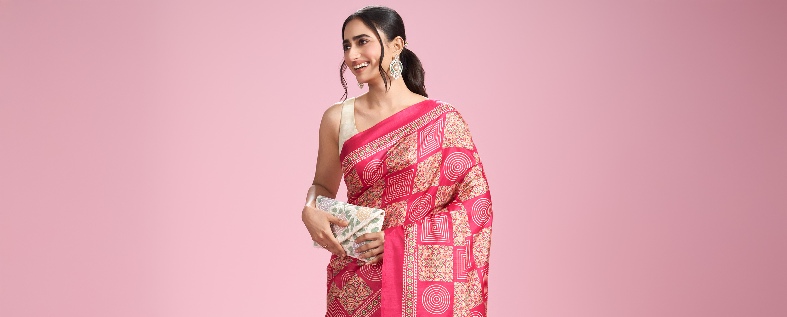 Women wearing Pink Floral Saree With Rhinestone Work Women wearing Pink Floral Saree With Rhinestone Work