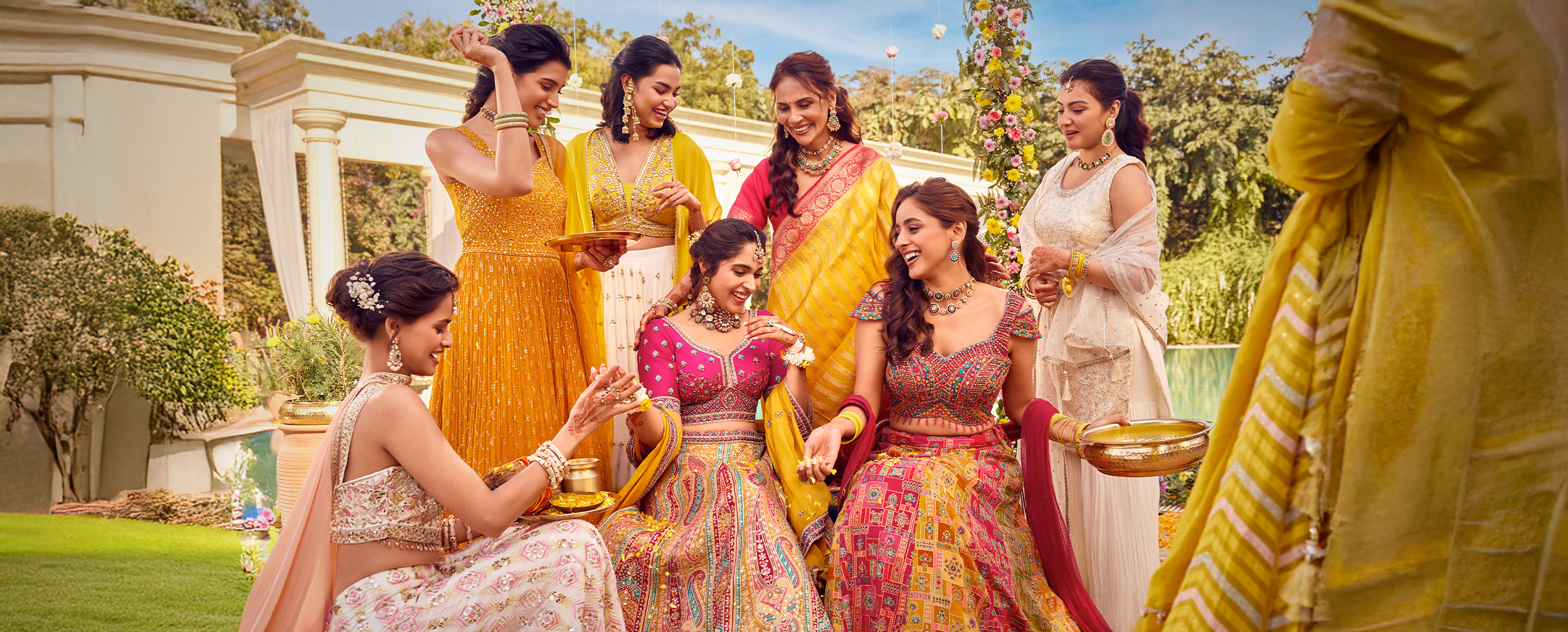 A bride and bridesmade wearing beautifull matching outfit A bride and bridesmade wearing beautifull matching outfit